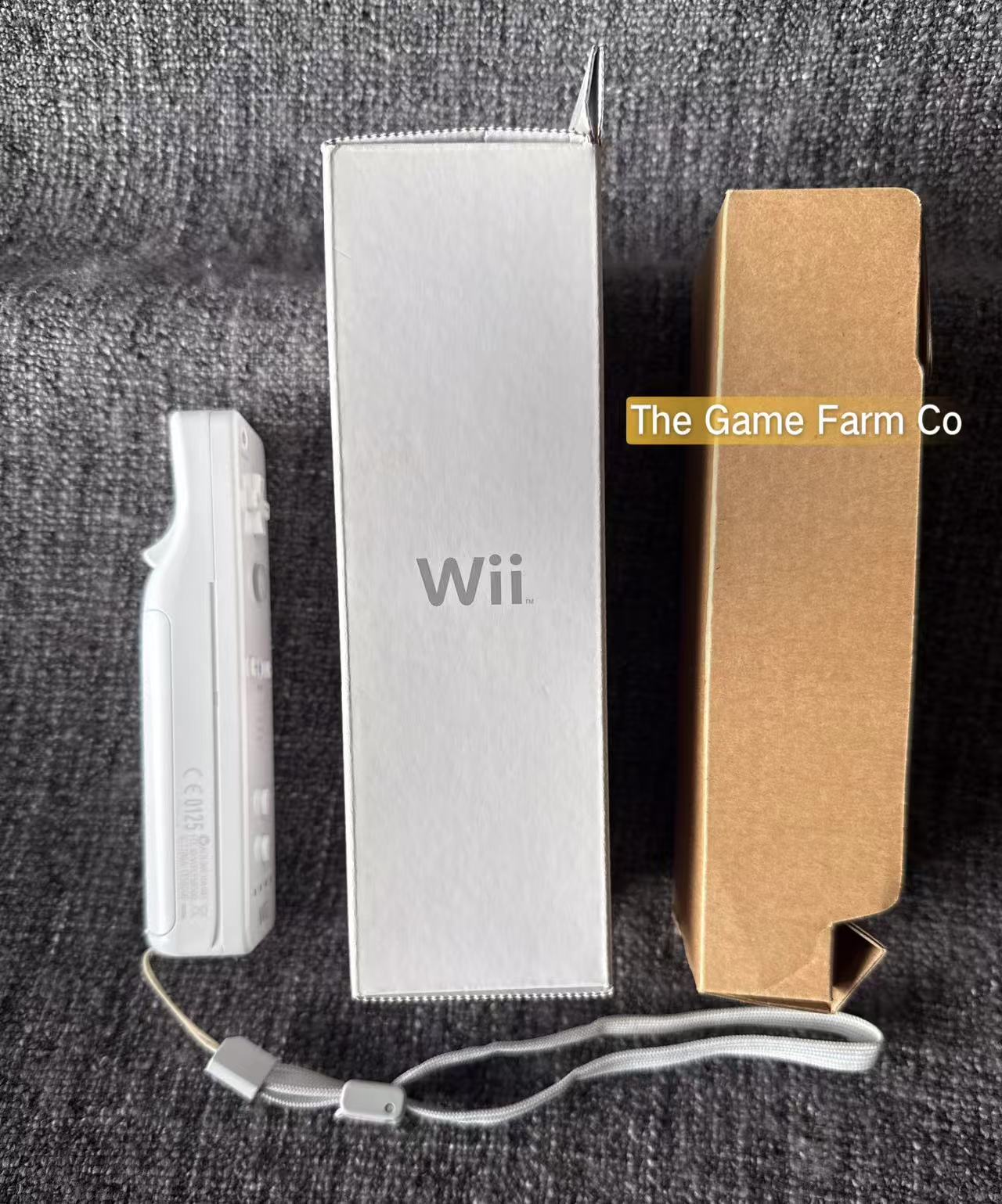 Genuine Nintendo Wii remote + Sleeve boxed in excellent condition